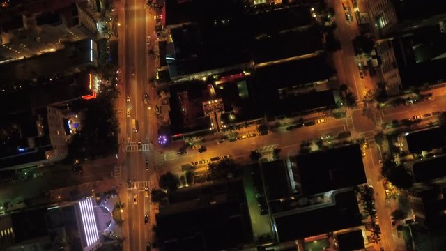 Miami Aerial v40 Flying low over Miami Beach looking down vertically at night.