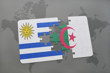 puzzle with the national flag of uruguay and algeria on a world map