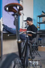 Man sitting on chair with legs on table