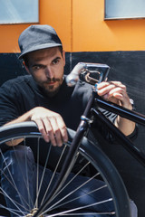 Professional craftsman looking at bicycle