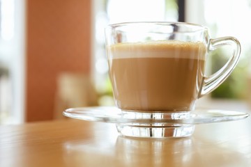 A glass of latte coffee.