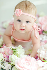 Fototapeta na wymiar Little baby and flowers 