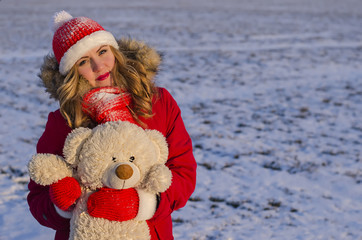 girl holding a teddy bear