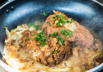 frying  chicken milanese in pan