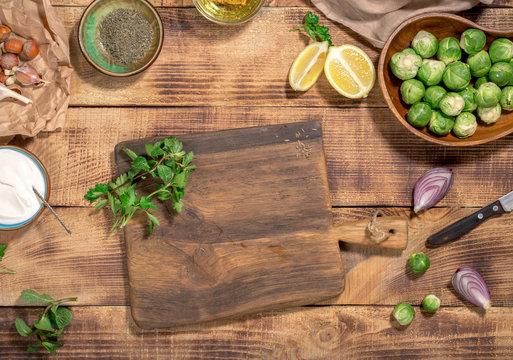 Around the wooden cutting board ingredients for cooking healthy food