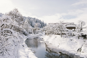 River surrounded with snow at Takayama