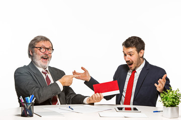 Concept - corruption. Businessman in a suit taking a bribe