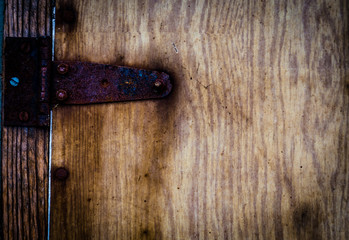 Wood texture. Metal elements on the wooden texture. The background of the wooden planks.