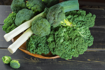 Green winter superfood - Kale green cabbage, broccoli and leeks prei