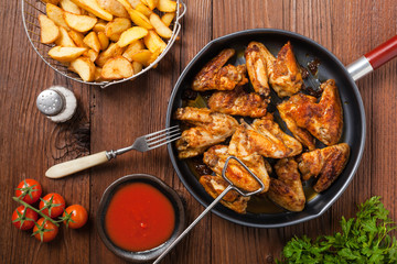 Baked wings, served with dip or baked potatoes.