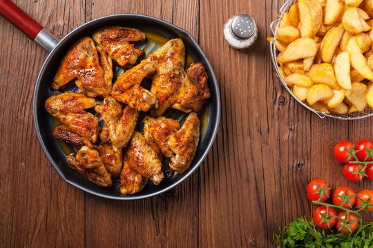 Baked wings, served with dip or baked potatoes.