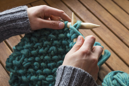 Knitting a woolen scarf