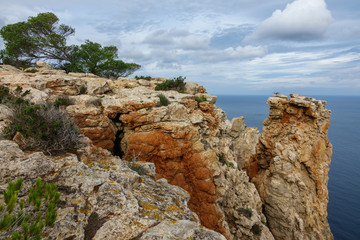Fototapeta na wymiar Rock cliff near sea in Ibiza