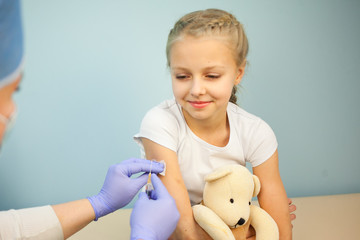 The pediatrician or nurse to vaccinate boy or girl, child vaccination