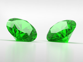 Green Diamonds isolated on white background with light reflection. 3d