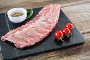 Beef ribs, chillies, cherry tomatoes and coriander seeds