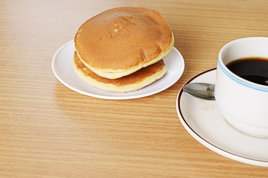 Close up of Japanese bean pancake with black coffee cup