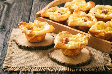 Appetizer -mini pies with mashed potatoes, bacon and cheese.