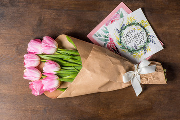 pink tulips bouquet and postcards