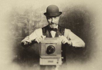 The bearded photographer with retro camera