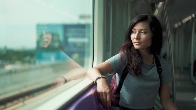 pretty girl travelling in a train of underground