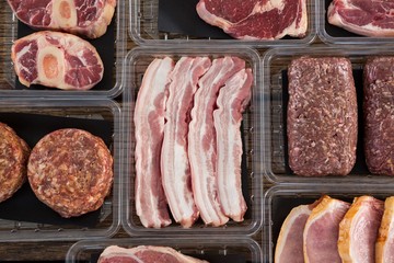Varieties of meat in plastic boxes