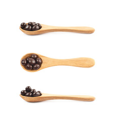 Wooden spoon full of candies