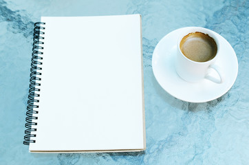 coffee cup and notebook blank page