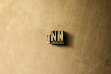 INN - close-up of grungy vintage typeset word on metal backdrop. Royalty free stock illustration.  Can be used for online banner ads and direct mail.