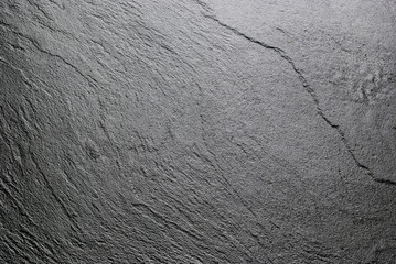 Dark slate background texture.