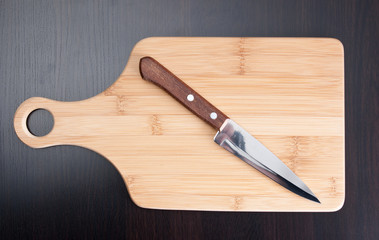 wooden cutting board and knife