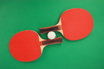 tennis racquets on  green table