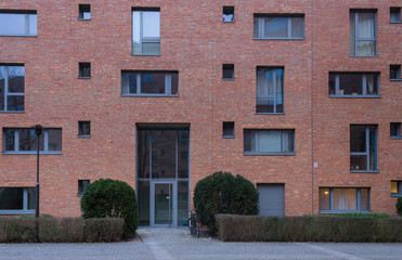 Naklejka premium Modern Apartment Building Red Brick Facade