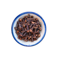 Pile cloves in bowl on white. This has clipping path.