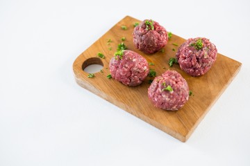Minced beef on wooden tray