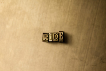 RIDE - close-up of grungy vintage typeset word on metal backdrop. Royalty free stock illustration.  Can be used for online banner ads and direct mail.