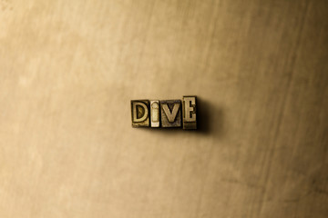 DIVE - close-up of grungy vintage typeset word on metal backdrop. Royalty free stock illustration.  Can be used for online banner ads and direct mail.