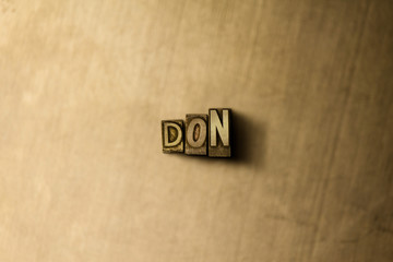 DON - close-up of grungy vintage typeset word on metal backdrop. Royalty free stock illustration.  Can be used for online banner ads and direct mail.