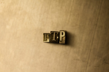 FTP - close-up of grungy vintage typeset word on metal backdrop. Royalty free stock illustration.  Can be used for online banner ads and direct mail.