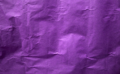 Old crumpled purple paper texture