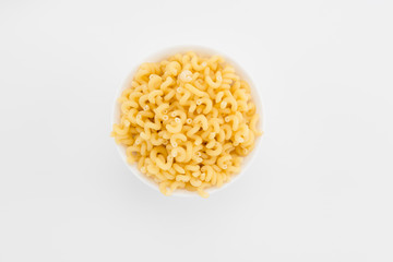 Uncooked macaroni in plate