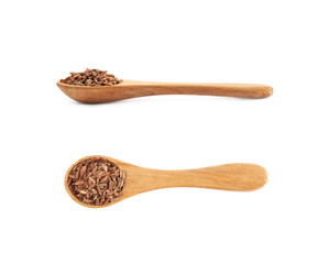 Wooden spoon of brown rice