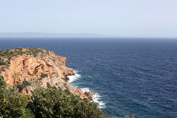 High cliff in Mediterranean sea, Greece 