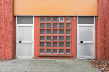 Facade with Large Window of Glass Bricks and Metal Doors, Front View