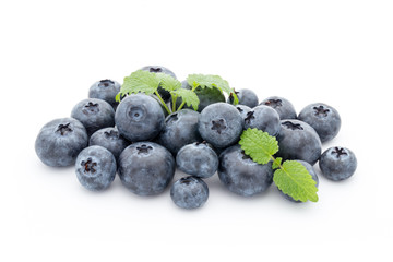 Close up of a blueberry branch isolated over white.