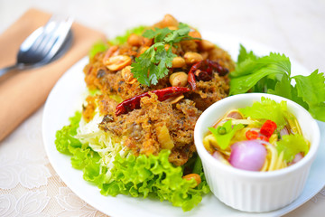 Crispy catfish salad with green mango and vegetable
