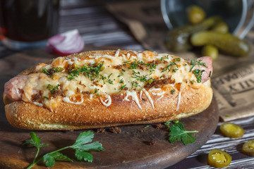 Hot dog with cheese and beer