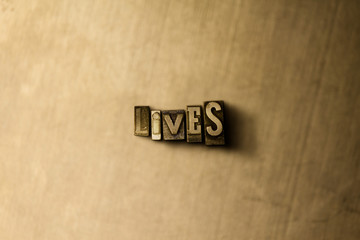 LIVES - close-up of grungy vintage typeset word on metal backdrop. Royalty free stock illustration.  Can be used for online banner ads and direct mail.