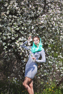 Beautiful Woman Fashion Model with Apple Tree Flowers