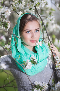 Beautiful Woman Fashion Model with Apple Tree Flowers